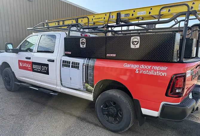 A pickup truck featuring a ladder mounted on its roof, ready for work.